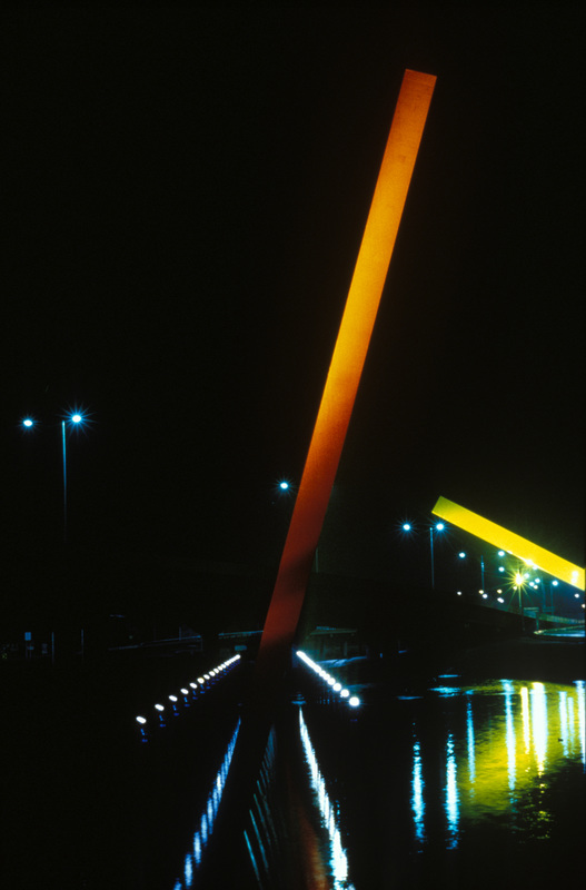 Leaning orange beam over black water at night, CityLink, Melbourne